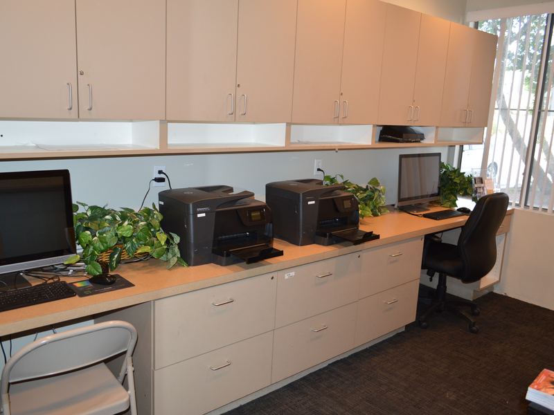 Business center with computers and printers