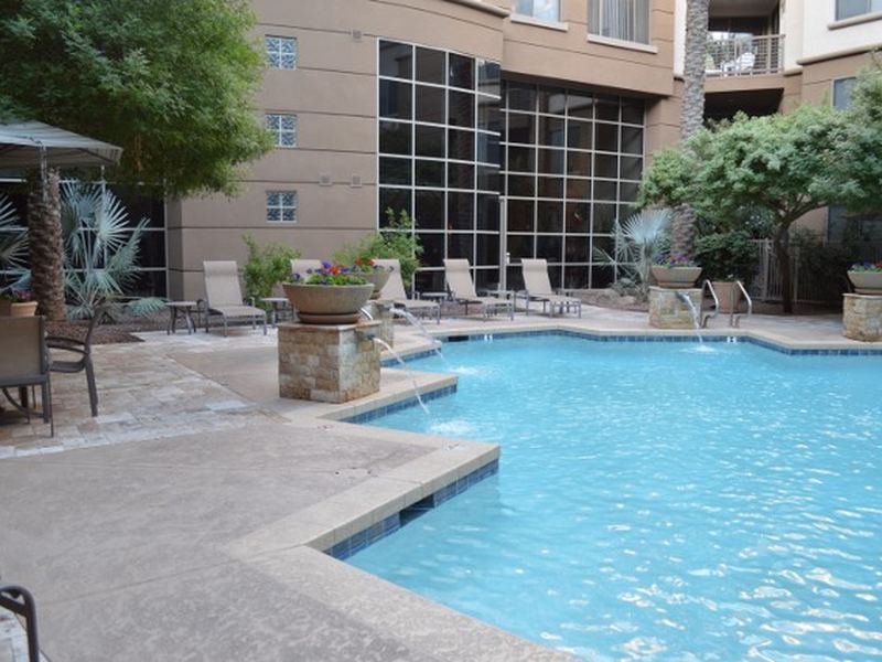 Courtyard pool framed by the residence building