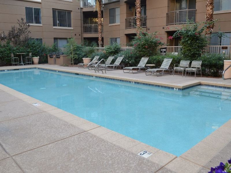 Lap pool with lounge chairs along the edge